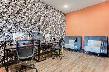 a workspace with two desks two chairs and a printer at Century Belmont Station, Louisville, KY, 40243